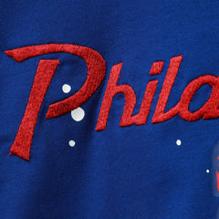 Philadelphia 76ers Women's Courtside Splatter Cropped T-Shirt - Royal | Nike online