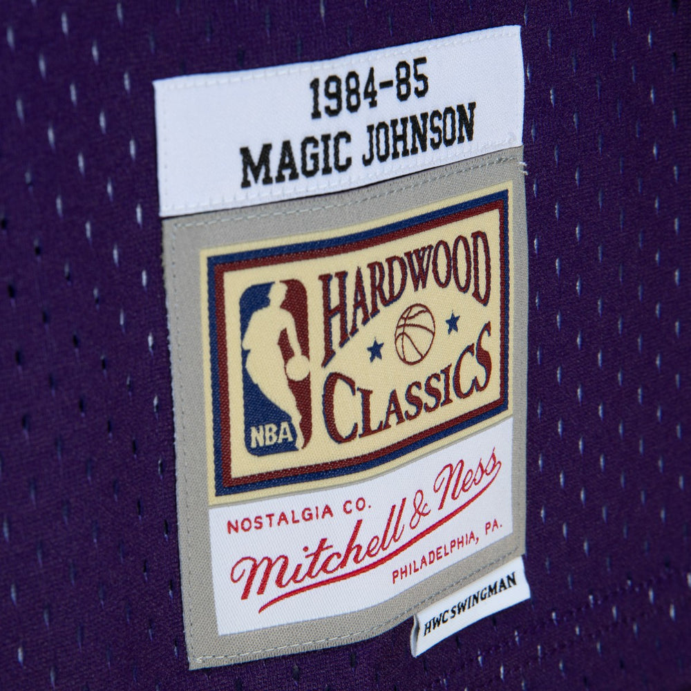 Magic Johnson Los Angeles Lakers 1984/85 Hardwood Classics Fadeaway Swingman Player Jersey - Purple/Black | Mitchell & Ness for sale